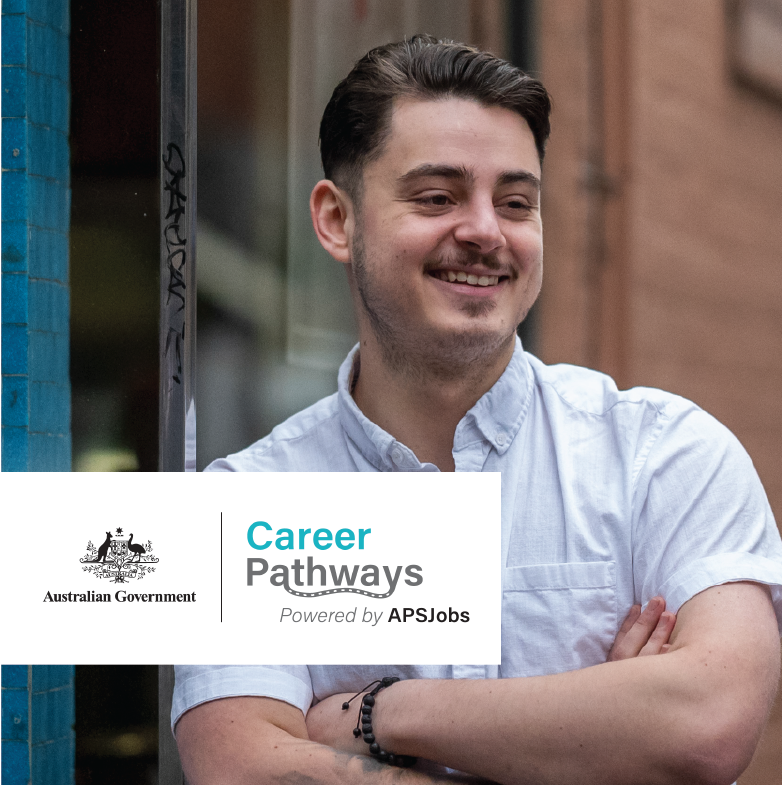 Smiling young male with looking away from the camera, with a 'Australian Government Career Pathways' logo tile