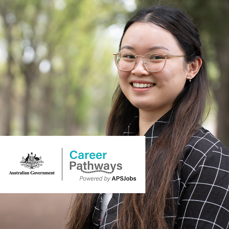Young woman in a dark blazer standing to the right in a park, the Career Pathways lockup is on the bottom left.